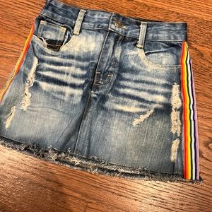 Girls denim skirt with rainbow ribbon.